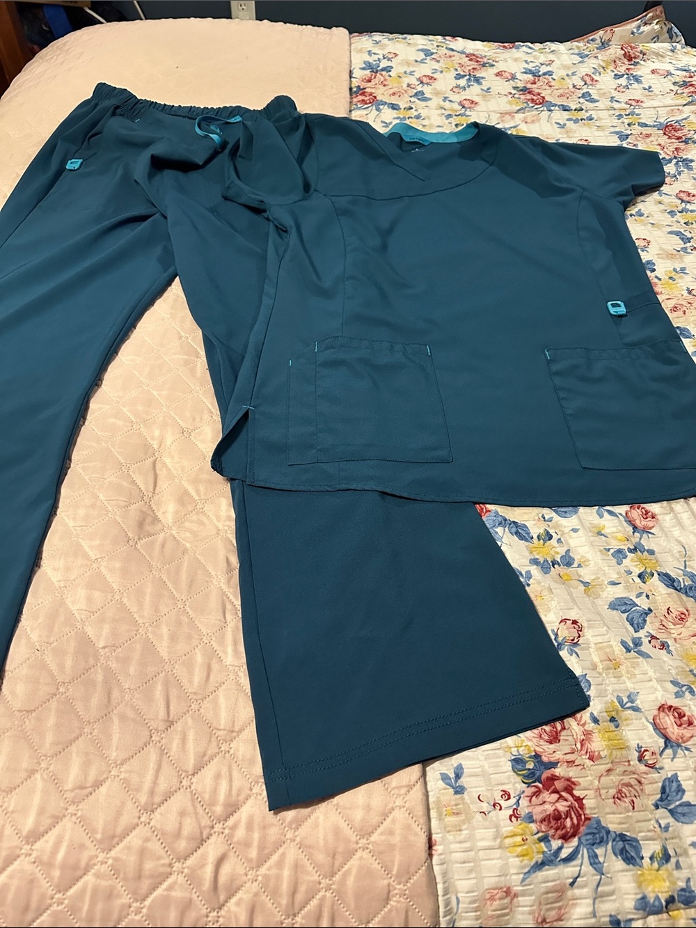 Carhartt green scrub Pants with Teal Accent Loop: top and bottom set.